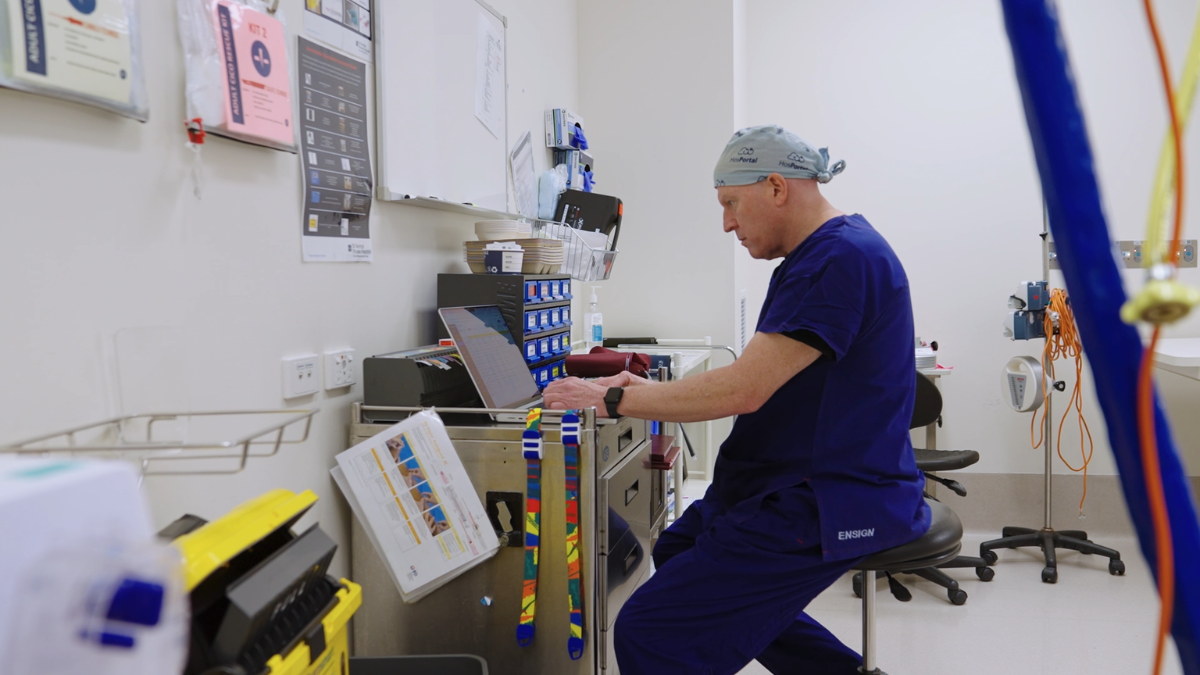 Dr Chris Jones using integrated hospital timesheet and rostering software within a clinical environment